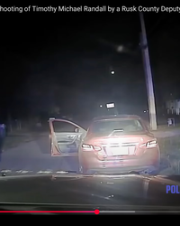 The-officer-fires-at-Randall-as-his-hands-are-up-in-the-air